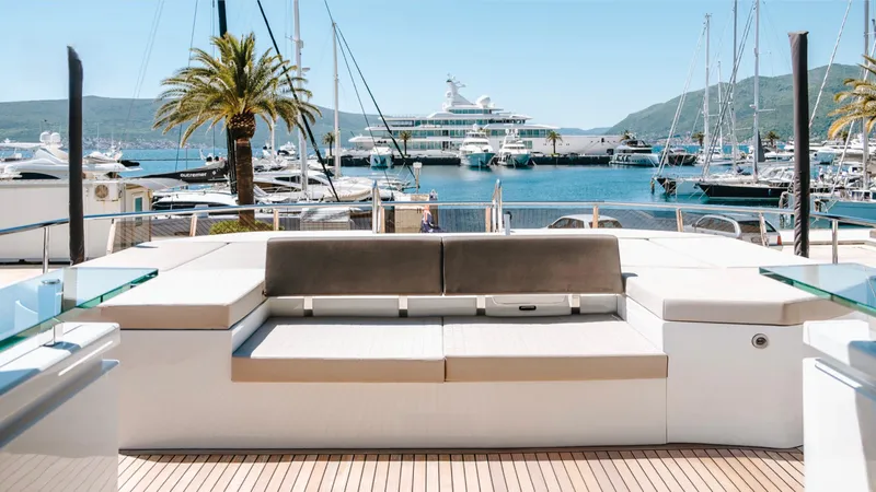  Yacht Photos Pics Astondoa 100 Century 2017 yacht with luxurious deck seating, marina view, and surrounding yachts.