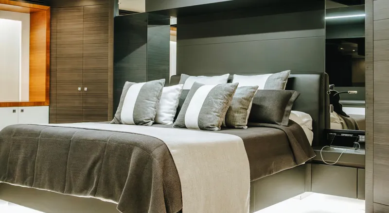  Yacht Photos Pics Luxurious bedroom interior on 2017 Astondoa 100 Century yacht, featuring elegant bedding and modern design.