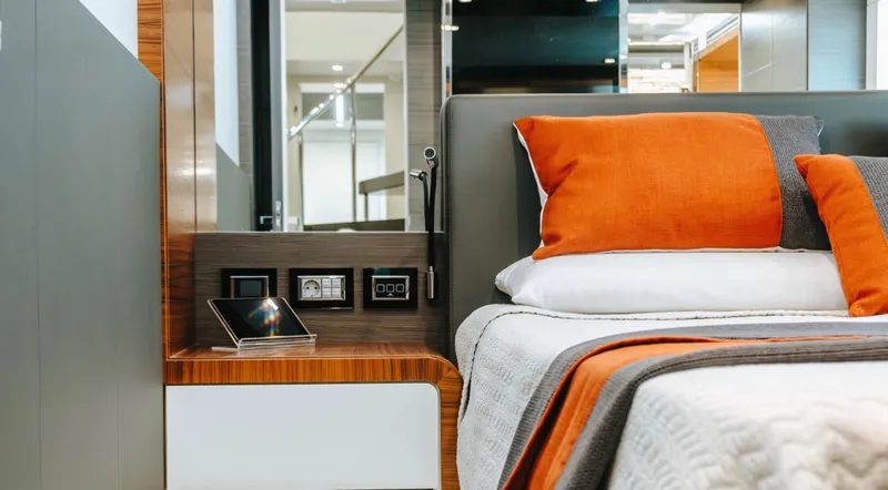  Yacht Photos Pics Luxurious bedroom interior on 2017 Astondoa 100 Century yacht with modern design and orange accents.