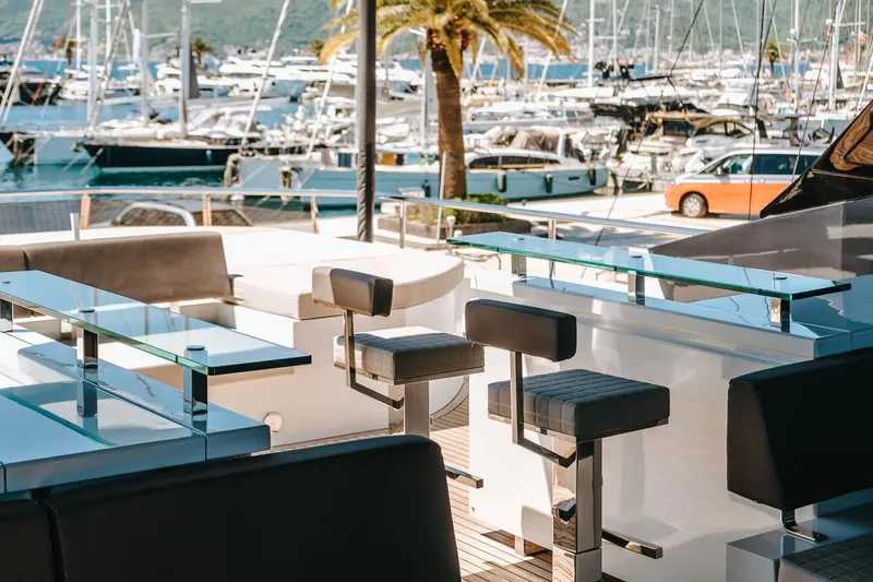  Yacht Photos Pics Luxurious 2017 Astondoa 100 Century yacht interior with marina view, featuring sleek seating and modern design.