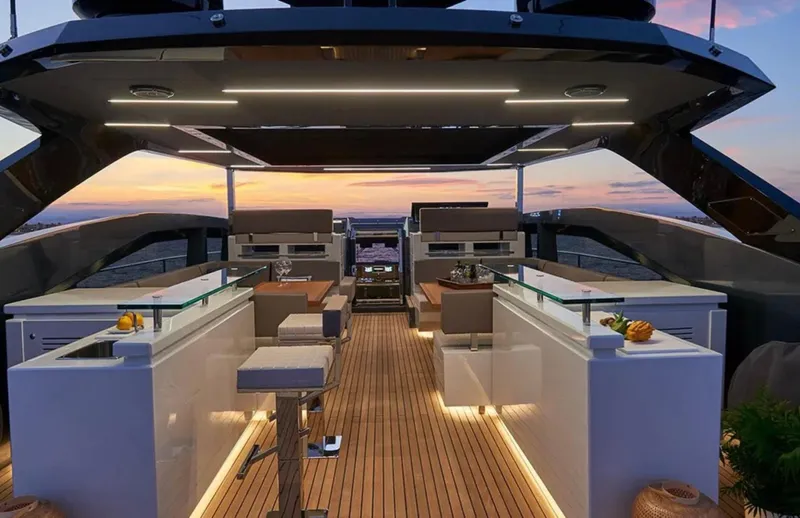  Yacht Photos Pics Luxurious 2017 Astondoa 100 Century yacht deck at sunset, featuring modern design and elegant lighting.