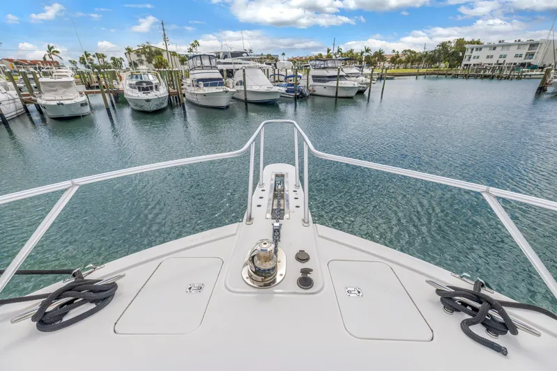Reel Blonde Yacht Photos Pics Bow view of 1999 Viking 72 Enclosed Bridge yacht in marina.