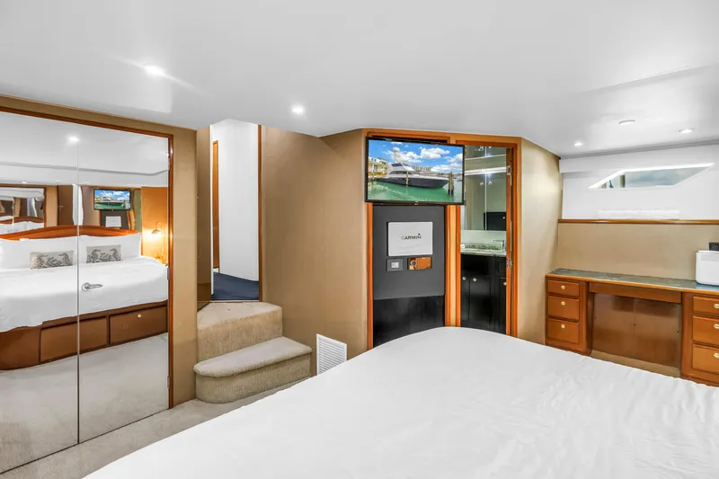 Reel Blonde Yacht Photos Pics Luxurious interior of 1999 Viking 72 Enclosed Bridge yacht with modern amenities.