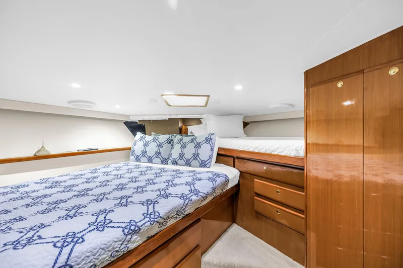 Reel Blonde Yacht Photos Pics Luxurious cabin interior of 1999 Viking 72 Enclosed Bridge yacht with twin beds.