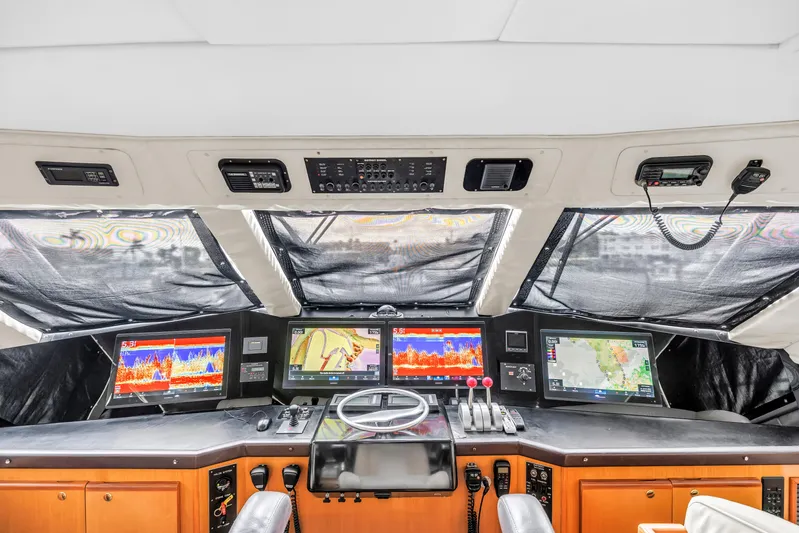 Reel Blonde Yacht Photos Pics Interior of 1999 Viking 72 Enclosed Bridge yacht with advanced navigation systems.