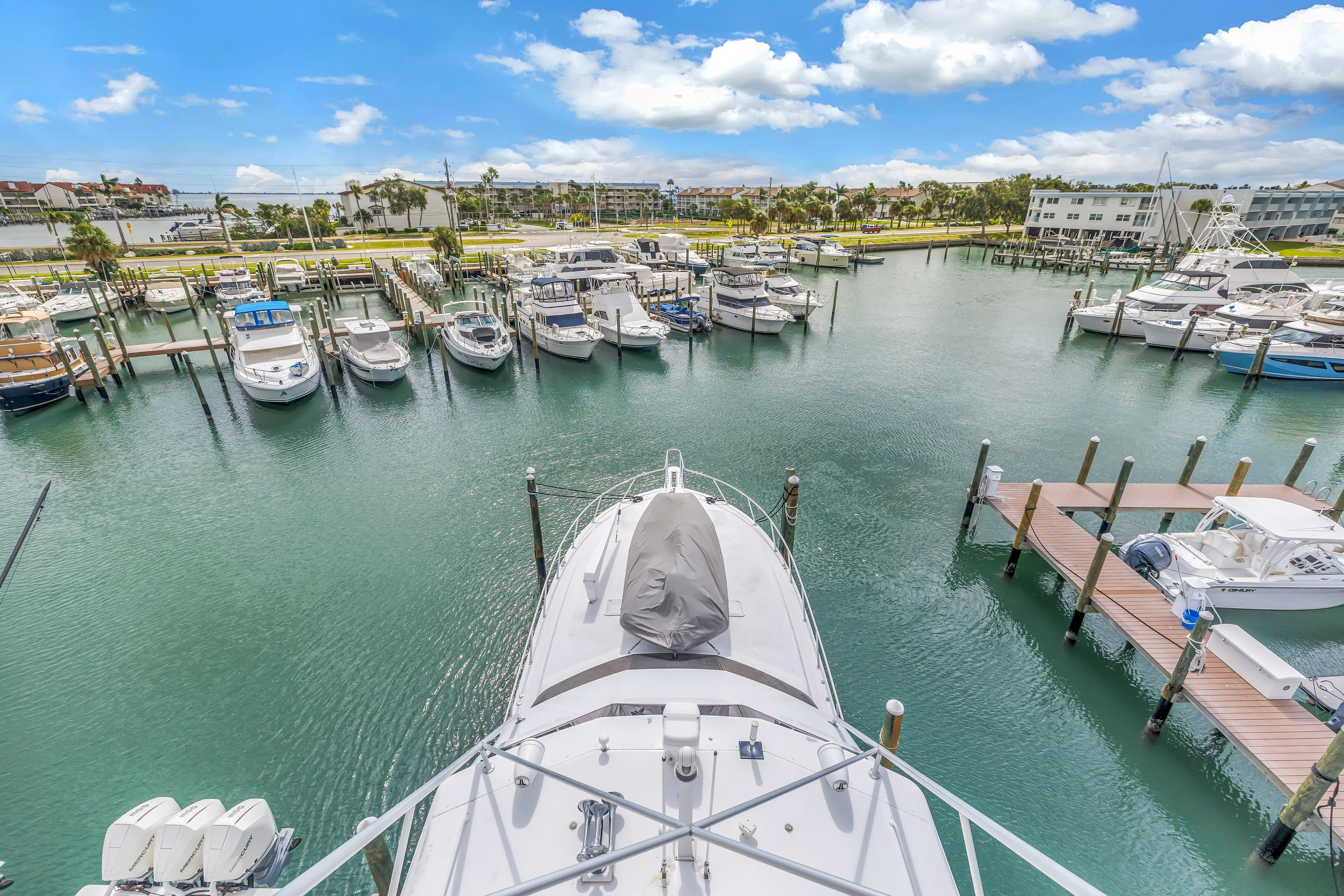 Reel Blonde Yacht Photos Pics Aerial view of 1999 Viking 72 Enclosed Bridge yacht docked in a marina.