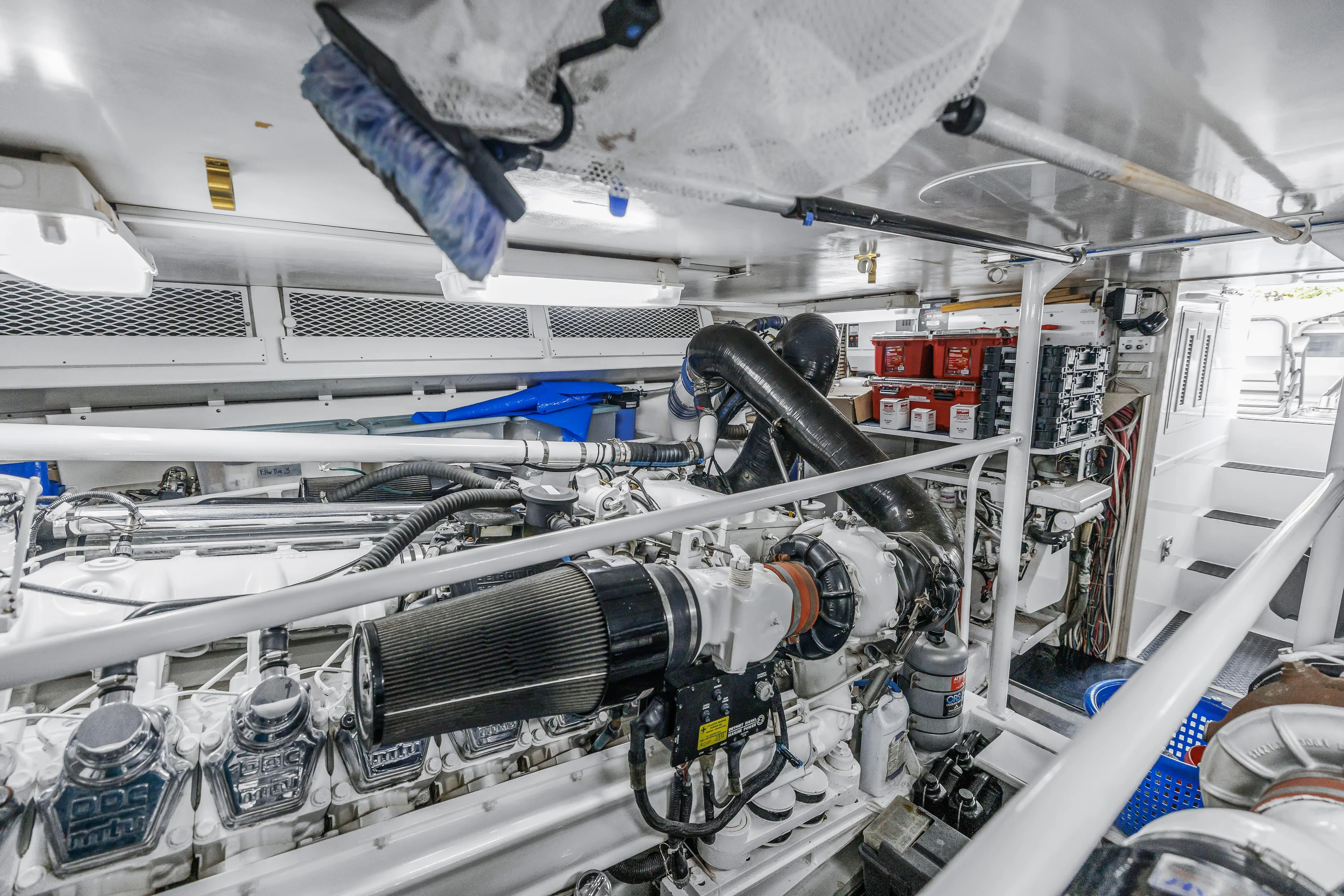 Reel Blonde Yacht Photos Pics Engine room of a 1999 Viking 72 Enclosed Bridge yacht, showcasing machinery and equipment.