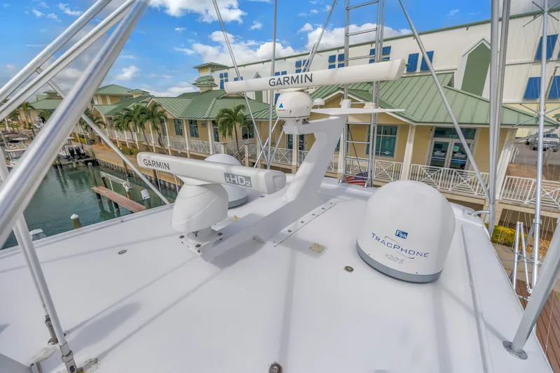 Reel Blonde Yacht Photos Pics Rooftop view of 1999 Viking 72 Enclosed Bridge with Garmin and TracPhone equipment.