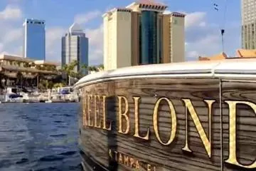 Reel Blonde Yacht Photos Pics 1999 Viking 72 Enclosed Bridge yacht docked with city skyline in background.