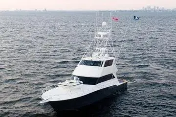 Reel Blonde Yacht Photos Pics 1999 Viking 72 Enclosed Bridge yacht cruising on open water.