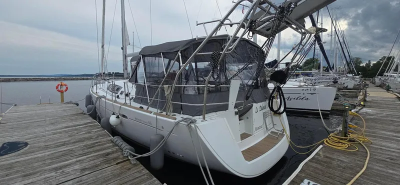 Diamant Noir Yacht Photos Pics Beneteau Oceanis 46 sailboat docked at marina, 2011 model, overcast sky.