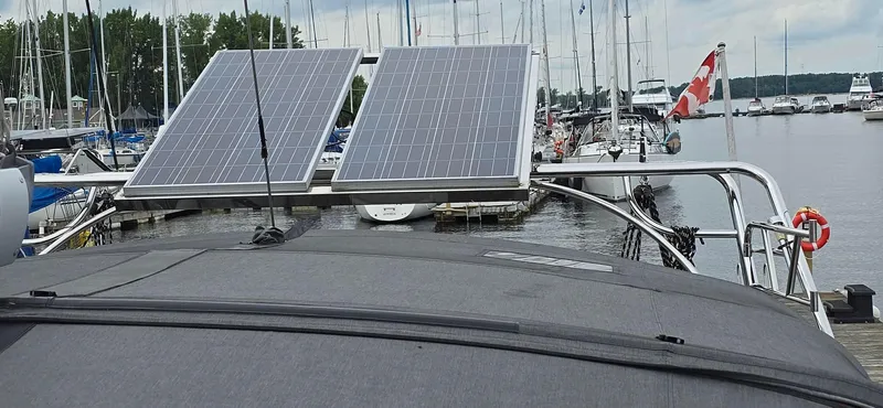 Diamant Noir Yacht Photos Pics Beneteau Oceanis 46 sailboat with solar panels docked at a marina, 2011 model.