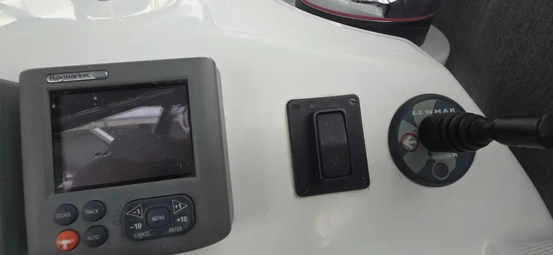 Diamant Noir Yacht Photos Pics Control panel of a 2011 Beneteau Oceanis 46 sailboat with navigation display.