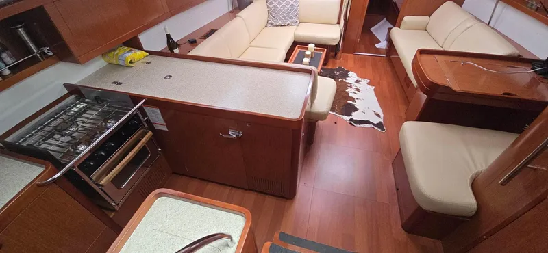 Diamant Noir Yacht Photos Pics Interior of 2011 Beneteau Oceanis 46 yacht with modern kitchen and seating area.