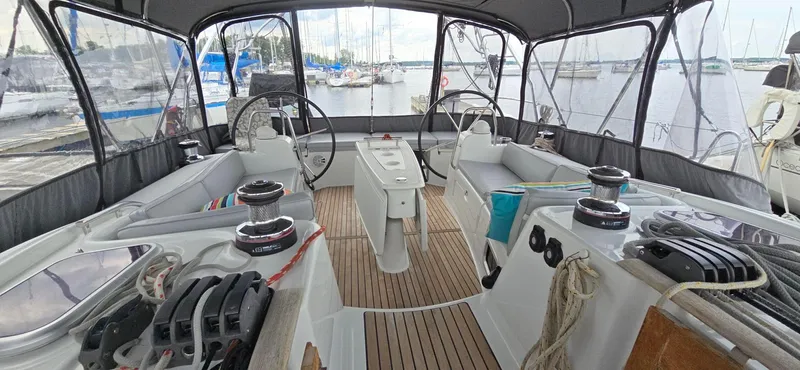 Diamant Noir Yacht Photos Pics Beneteau Oceanis 46 cockpit, 2011 model, featuring dual steering wheels and spacious seating.