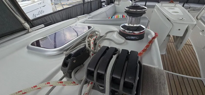 Diamant Noir Yacht Photos Pics Deck view of 2011 Beneteau Oceanis 46 sailboat, featuring winch and rope system.