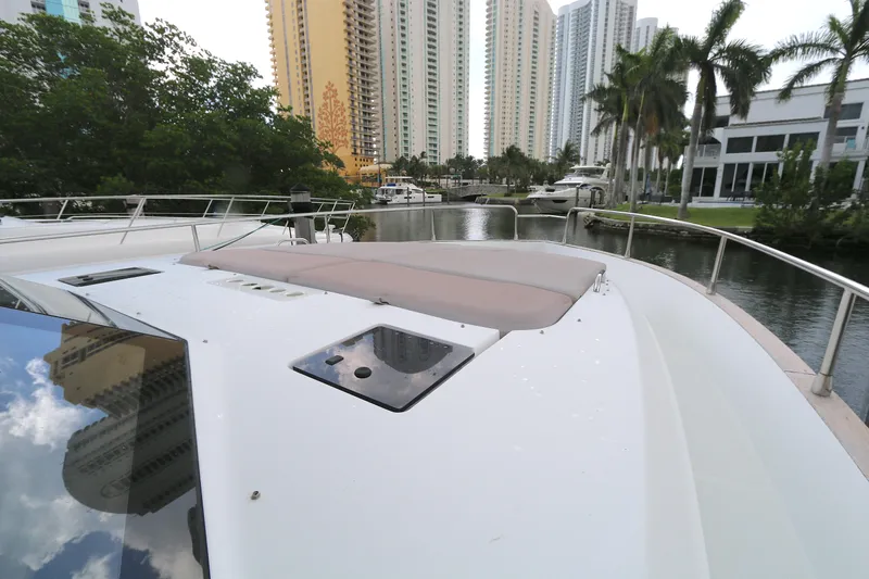  Yacht Photos Pics 2014 Azimut Magellano 43 yacht docked near high-rise buildings and palm trees.