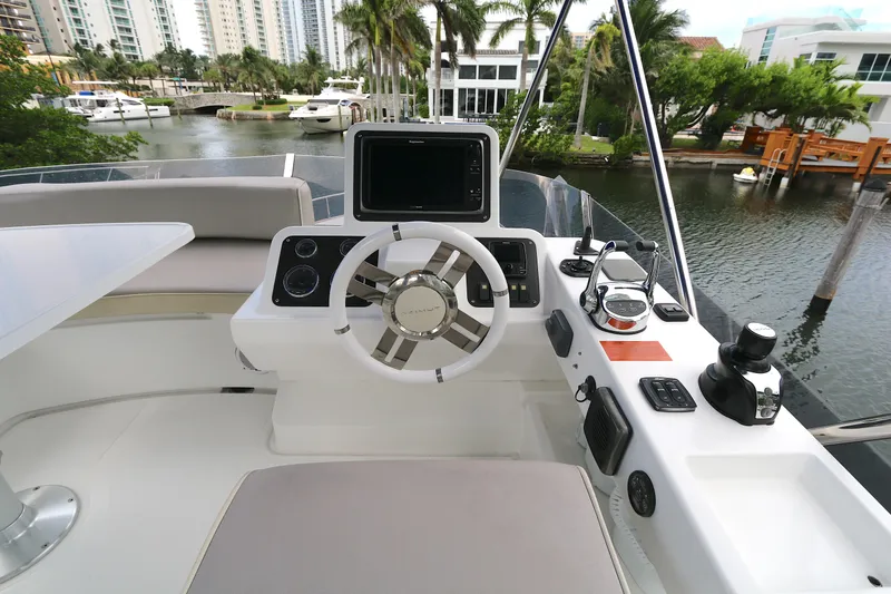  Yacht Photos Pics 2014 Azimut Magellano 43 yacht helm with modern controls and waterfront view.