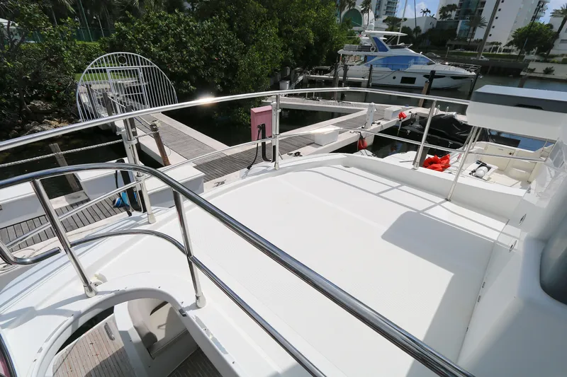  Yacht Photos Pics Azimut Magellano 43 yacht deck, 2014 model, docked with railing and marina view.