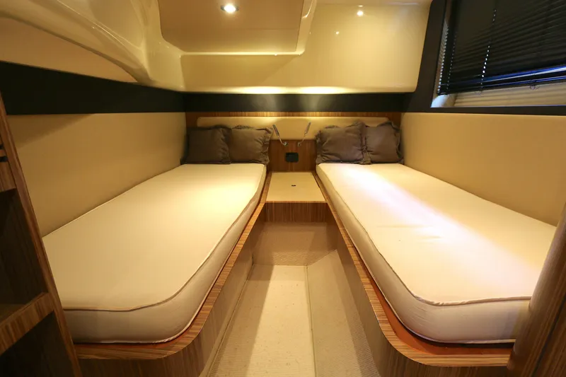  Yacht Photos Pics Interior cabin of 2014 Azimut Magellano 43 yacht with twin beds and cushions.