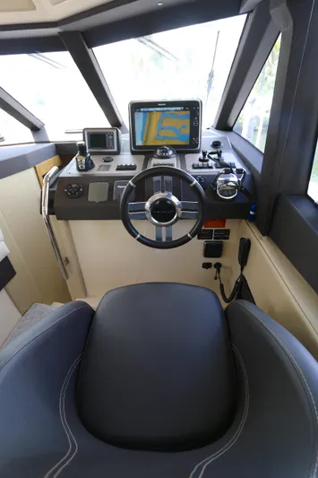  Yacht Photos Pics Cockpit of 2014 Azimut Magellano 43 yacht with navigation equipment and steering wheel.