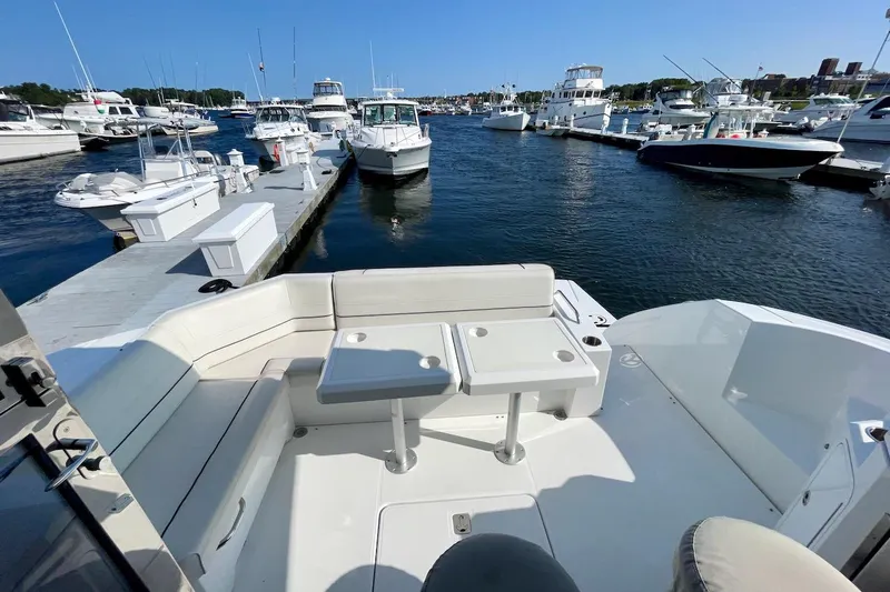 Salacia Yacht Photos Pics 2018 Cruisers Yachts 45 Cantius at marina, featuring spacious seating and docked boats.
