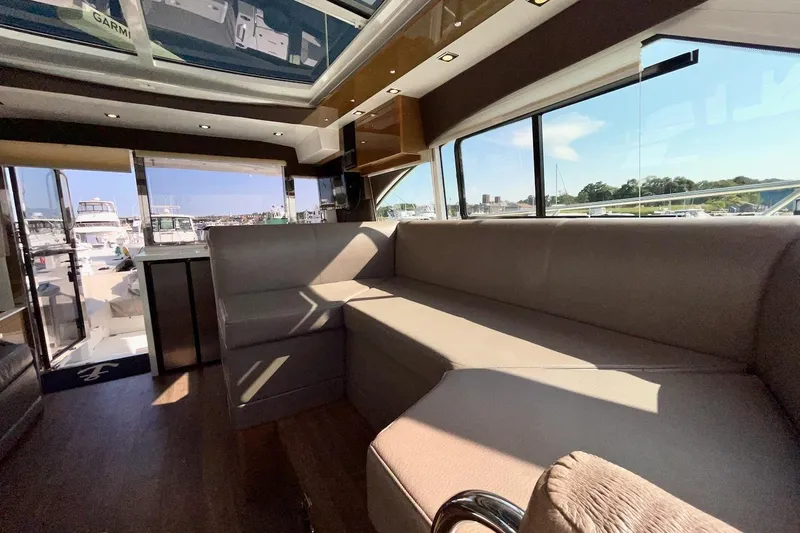 Salacia Yacht Photos Pics Luxurious interior of 2018 Cruisers Yachts 45 Cantius with panoramic windows and plush seating.