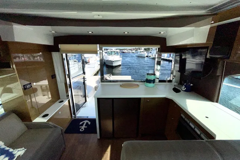 Salacia Yacht Photos Pics Interior view of 2018 Cruisers Yachts 45 Cantius, featuring modern design and marina backdrop.