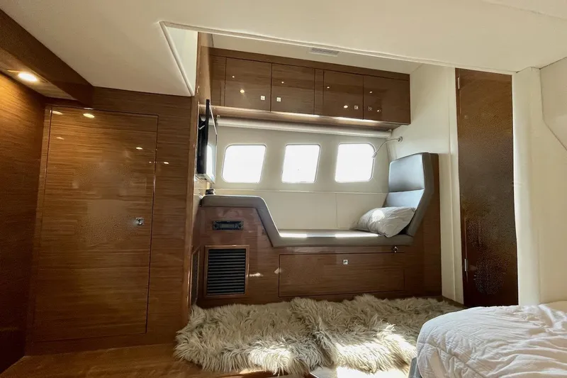 Salacia Yacht Photos Pics Luxurious interior of 2018 Cruisers Yachts 45 Cantius with cozy seating and elegant wood finish.