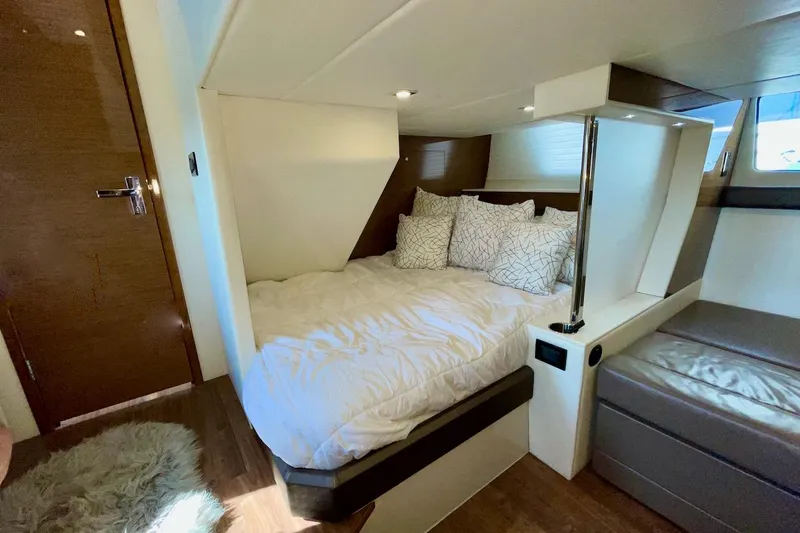 Salacia Yacht Photos Pics Luxurious bedroom interior of 2018 Cruisers Yachts 45 Cantius with cozy bedding.