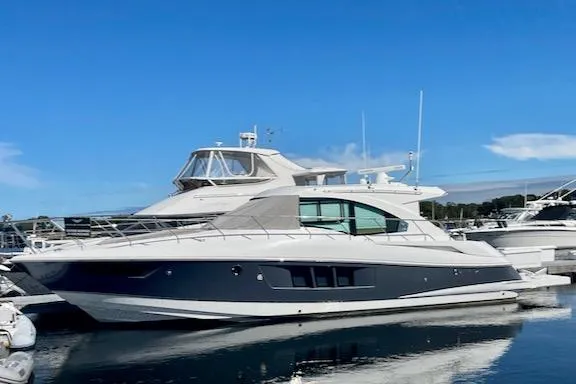 Salacia Yacht Photos Pics 2018 Cruisers Yachts 45 Cantius docked, sleek design, blue sky background.