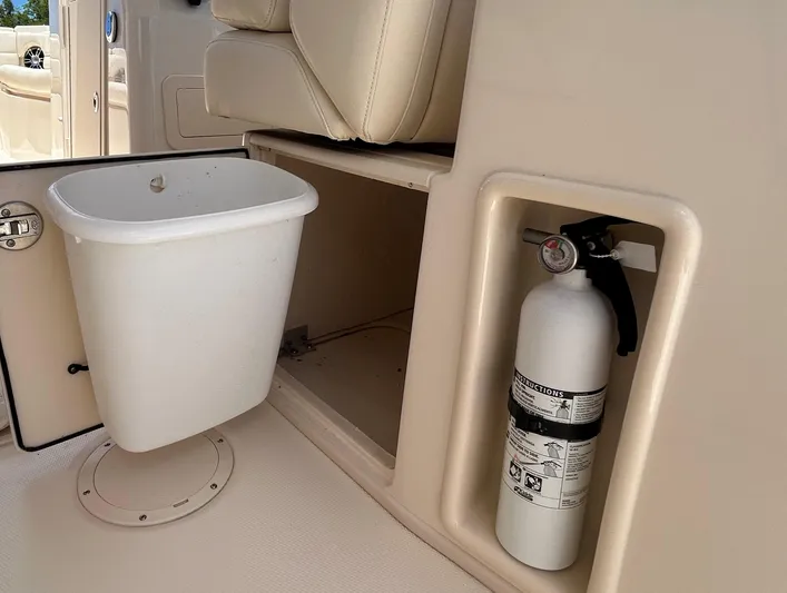  Yacht Photos Pics 2022 Grady-White 255 FREEDOM boat interior with fire extinguisher and storage compartment.