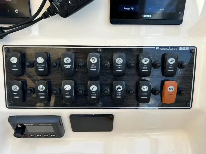  Yacht Photos Pics Control panel of 2022 Grady-White 255 Freedom boat with labeled switches and displays.