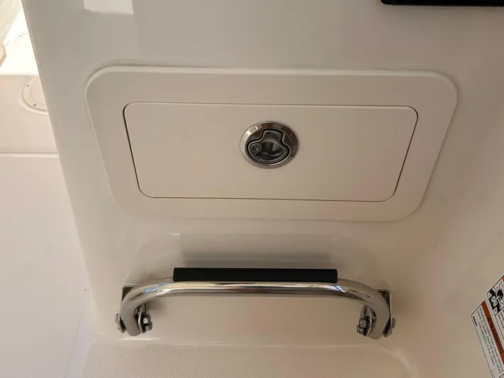  Yacht Photos Pics 2022 Grady-White 255 FREEDOM boat compartment with lock and stainless steel handle.