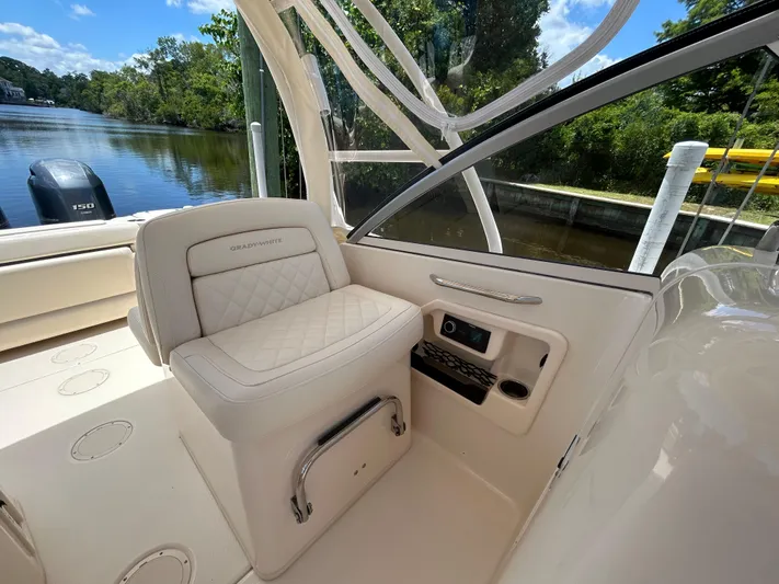  Yacht Photos Pics 2022 Grady-White 255 FREEDOM boat interior with luxurious seating and scenic water view.