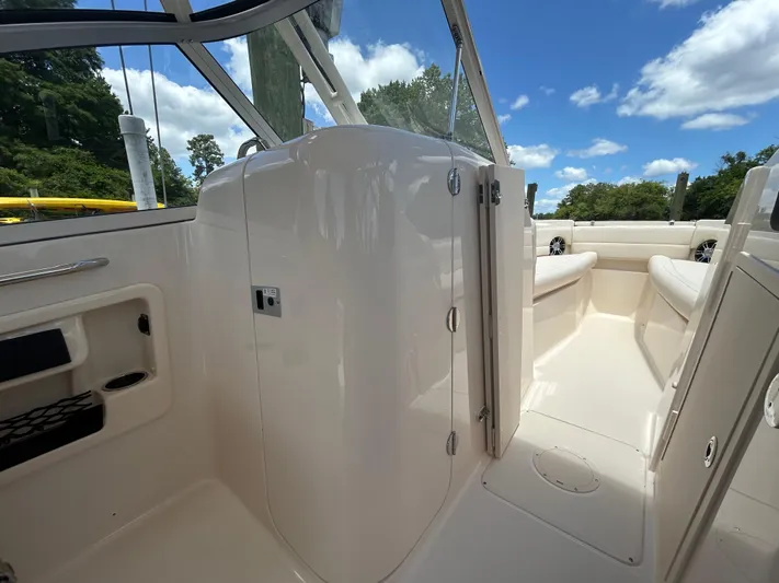 Yacht Photos Pics 2022 Grady-White 255 FREEDOM boat interior with seating and clear sky view.