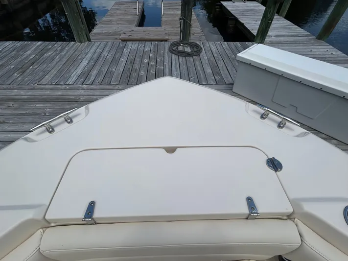  Yacht Photos Pics Bow view of 2022 Grady-White 255 FREEDOM boat docked at a wooden pier.