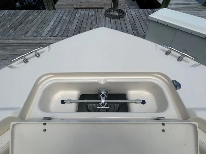  Yacht Photos Pics 2022 Grady-White 255 FREEDOM boat anchor compartment on wooden dock.