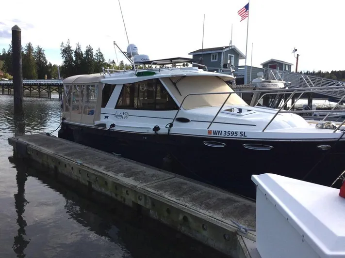 Lady K Yacht Photos Pics 2017 Cutwater C-28 boat docked with American flag.