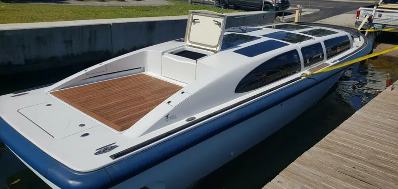  Yacht Photos Pics 2008 Goetz Custom Boats 33' Limo Tender docked, featuring sleek design and spacious deck.