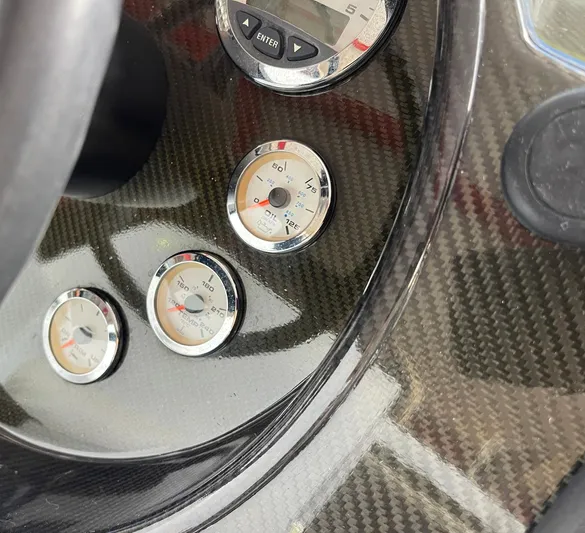  Yacht Photos Pics Carbon fiber dashboard with gauges on a 2008 Goetz Custom Boats 33' Limo Tender.