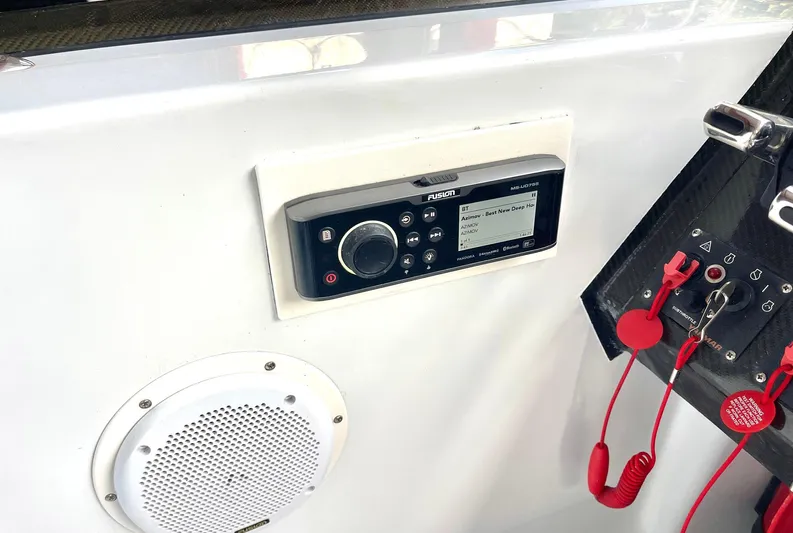  Yacht Photos Pics Control panel of a 2008 Goetz Custom Boats 33' Limo Tender with audio system and safety features.