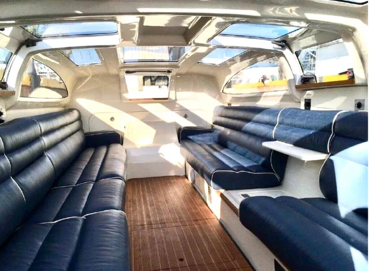  Yacht Photos Pics Luxurious interior of 2008 Goetz Custom Boats 33' Limo Tender with plush seating and skylights.