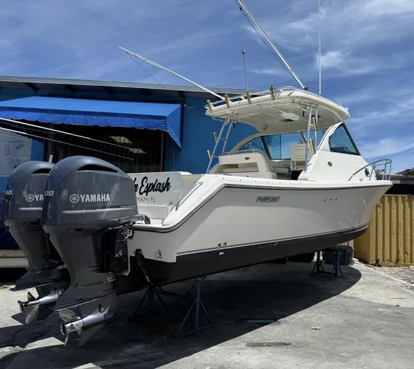  Yacht Photos Pics 2008 Pursuit OS 315 Offshore boat with twin Yamaha engines, docked outdoors.
