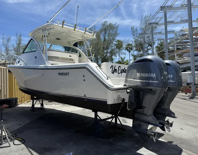  Yacht Photos Pics 2008 Pursuit OS 315 Offshore boat with twin Yamaha engines on dry dock.