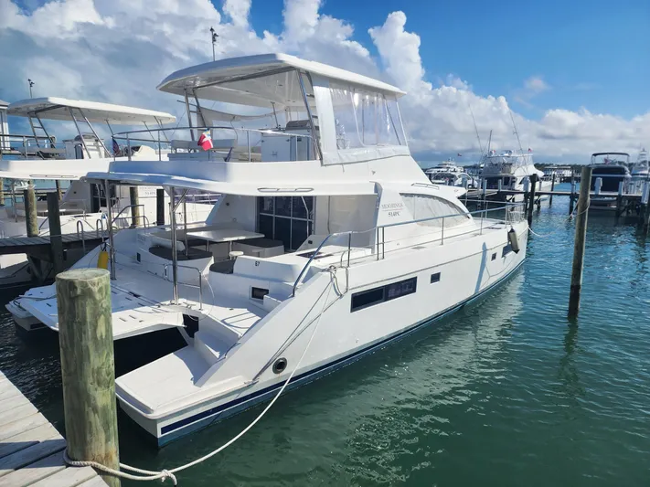 Miss Saigon Yacht Photos Pics 2019 Leopard 51 Powercat yacht docked at marina under clear skies.