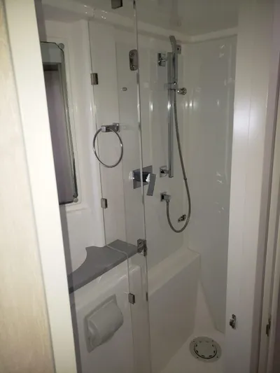 Miss Saigon Yacht Photos Pics 2019 Leopard 51 Powercat bathroom with modern shower and fixtures.