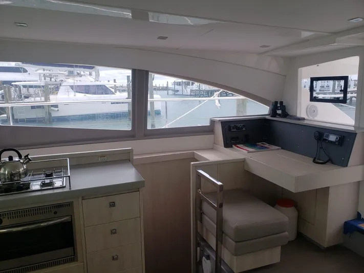 Miss Saigon Yacht Photos Pics Interior of 2019 Leopard 51 Powercat yacht with kitchen and navigation station.