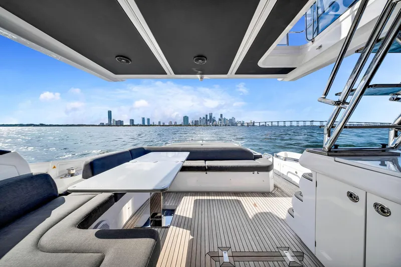 Amf Yacht Photos Pics Luxurious 2021 Azimut S6 yacht interior with ocean view and city skyline in the background.