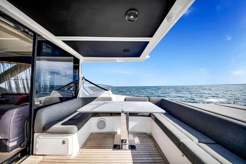 Amf Yacht Photos Pics Luxurious 2021 Azimut S6 yacht deck with seating, ocean view, and modern design.